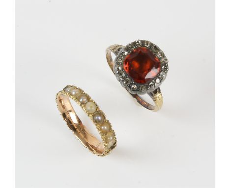 AMENDED DESCRIPTION A Georgian hessonite garnet ring, with closed back cushion cut garnet with a surround of mixed old cut di
