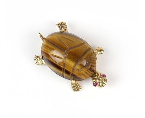 A tigers eye tortoise brooch, 14 ct tortoise with a claw set oval cabochon carved tigers eye as the tortoise shell, and ruby 