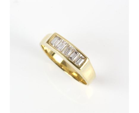 Diamond five stone ring, channel set with baguette cut diamonds weighing an estimated total of 0.65 carats, bezel set in 18 c