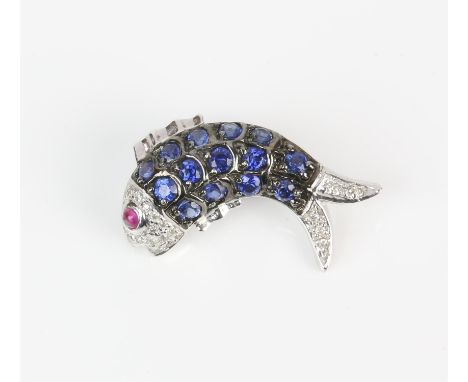 Fish brooch, body set with round cut sapphires with a diamond set head and tail and a ruby eye, mounted in 18 ct white gold, 