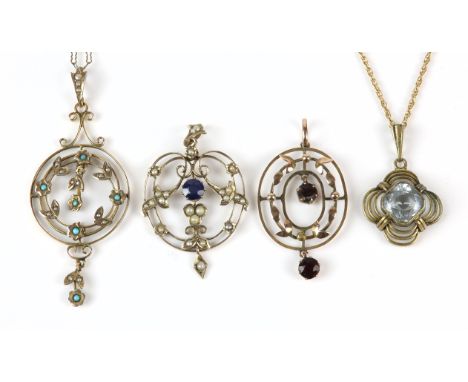Three Edwardian gem set openwork pendants, including a sapphire and seed pearl pendant, a garnet pendant, a turquoise and see