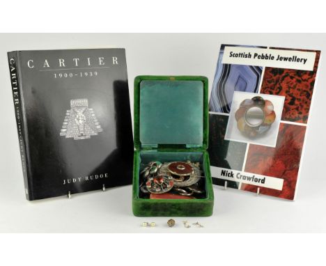 Fourteen Scottish agate brooches mounted in silver, together with a Cartier book, a Scottish Pebble jewellery book, and a clo