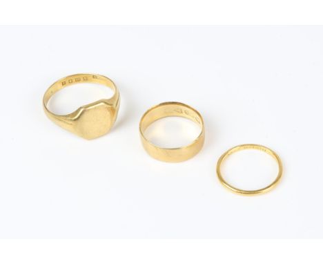 Two 18 ct rings including a signet ring, size U, and a 6.3mm wedding band size K, together with  22 ct, 1.6mm wedding band, s