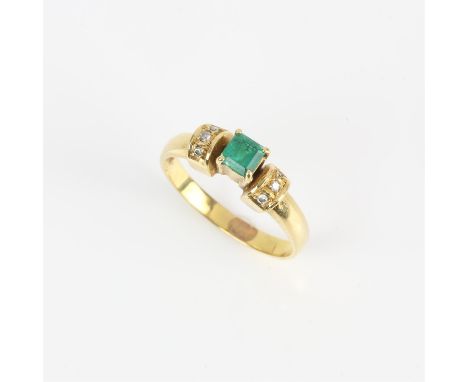 Emerald and diamond ring, central square step cut emerald weighing an estimated 0.23 carats, flanked by three round brilliant