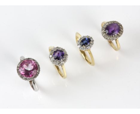 Four cluster rings, one sapphire and diamond, mounted in 18 ct, size N, two amethyst and diamond, both in 18 ct, sizes M and 