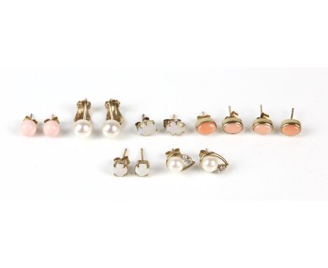 Seven pairs of stud earrings, including two opal pairs, three coral pairs, and two pearl pairs, one pair is gold plated, the 