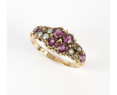 Garnet and pearl ring, set with four central round cut garnets, flanked either side by four seed pearls, and a garnet to each