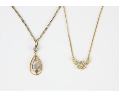 Two gem set necklaces, including a diamond floral cluster necklace, integrated on a trace chain with a bolt ring clasp, in 18