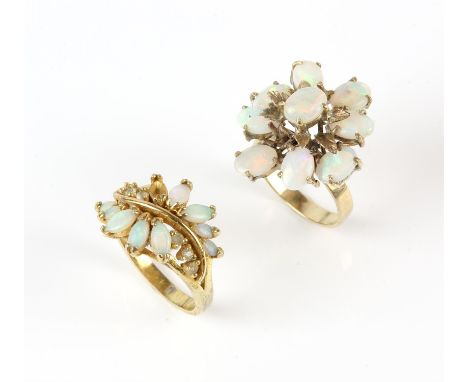 Two opal rings, one a floral cluster ring, set with oval cabochon opals, in 18 ct, size N, together with a gold plated opal a