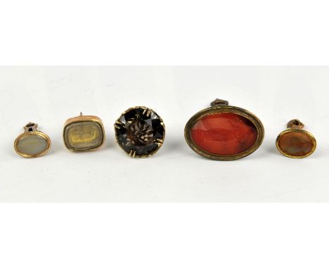 Five fob seals, including a Georgian rectangular fob seal set with rock crystal depicting a cat and a mouse and engraved plea