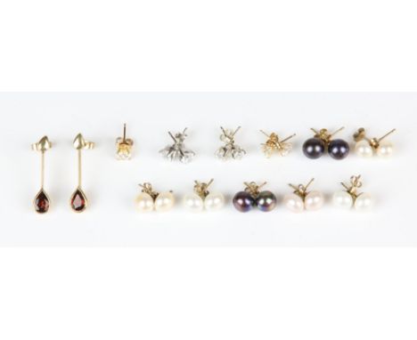 Eleven pair of earrings, including a pair of articulated garnet drop earrings each set with a pear cut garnet in 9 ct, two pa