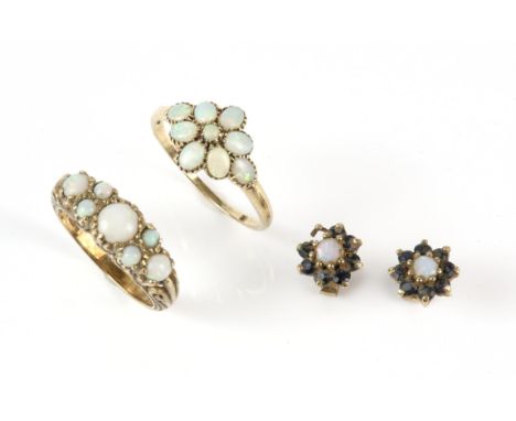 A collection of opal items, including a floral cluster ring set with oval cut opal cabochons, in 9 ct, size R½, a carved opal