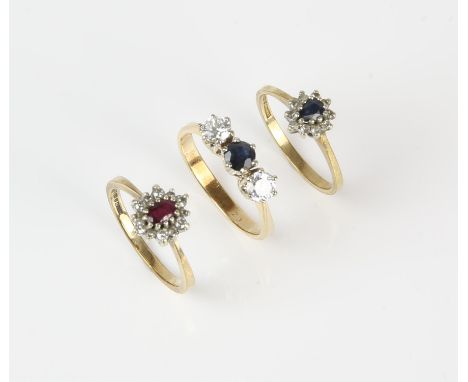 Three 9 ct gem set rings including a ruby and diamond floral cluster ring, ring size M, a sapphire and diamond floral cluster