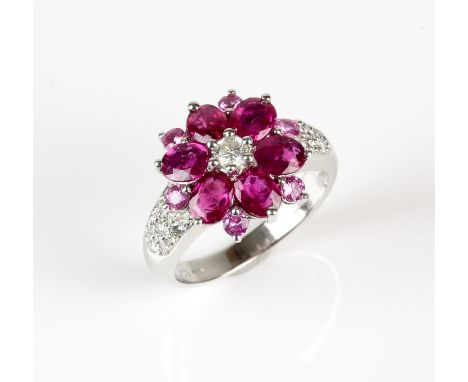 Ruby, sapphire and diamond floral cluster ring, with oval cut rubies weighing an estimated total of 2 carats, round cut pink 