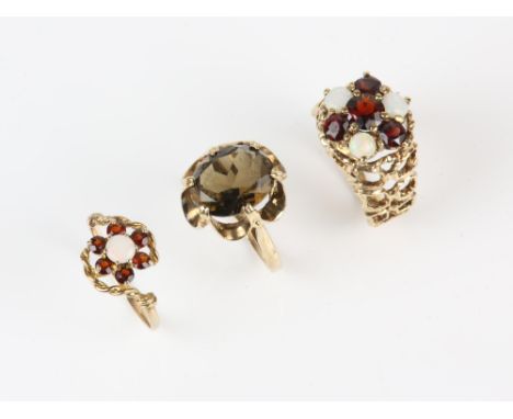 Three gem set rings, including a opal and paste cluster ring with textured openwork shoulders, in 9 ct, size M½, a smoky quar