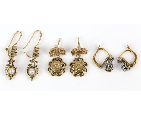 Three pairs of 14 ct earrings, including a pair of pearl drop earrings, a pair of floral wirework drop earrings, and a pair o