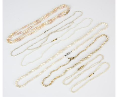 A selection of pearl necklaces, including two single rows of vari-coloured pearls on 9 ct clasps, a single row of cream pearl