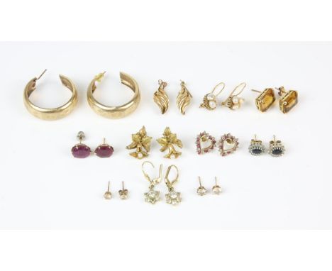 A collection of 9 ct earrings including a a pair of sapphire and diamond cluster earrings, a pair of carved hoops, a pair of 