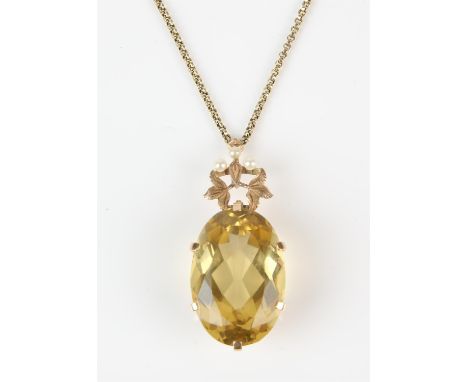 Citrine pendant necklace, oval cut citrine measuring an estimated 35.20 carats, with a foliate motif bale set with three seed