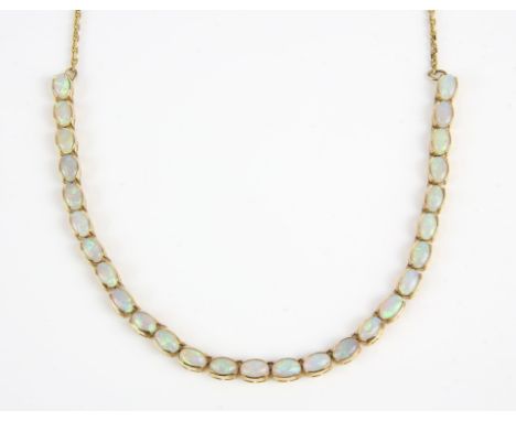 Opal necklace, 27 oval cabochon opals weighing an estimated 0.15 carats each, semi bezel set, and integrated on a trace link 