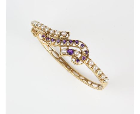 Amethyst and pearl hinged bangle, claw set stones in an openwork design set to the top of the bangle, with carved sides, in 1