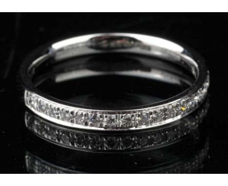 Modern diamond half eternity band, with round brilliant diamonds, estimated total weight 0.20 carats, mounted in platinum, ri