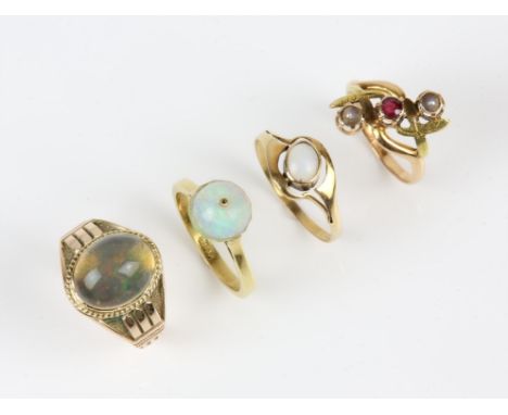 Four rings, an opal and rock crystal ring in 18 ct, ring size N, an opal ring in 18 ct, ring size P½, a ruby and seed pearl r