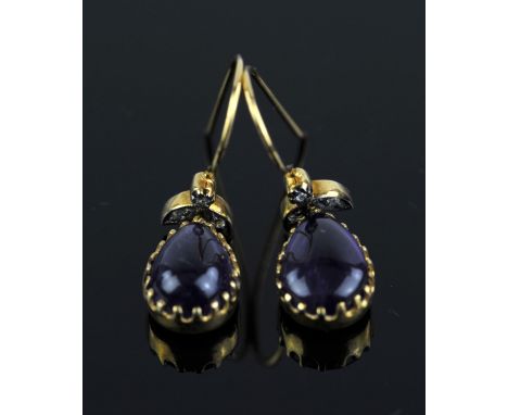 Amethyst and diamond drop earrings, pear cut cabochon amethyst drops mounted in silver gilt closed back settings, suspended f