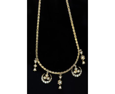 Edwardian seed pearl pendant, fancy link chain tested as 15 ct, with with two crescent drops stamped 15 ct and three triple p