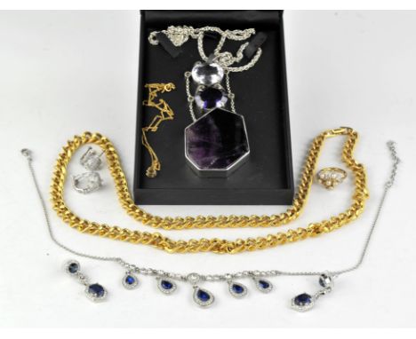 A collection of costume jewellery, including a fluorite and amethyst necklace in silver, a Swarovski pendant necklace, a long