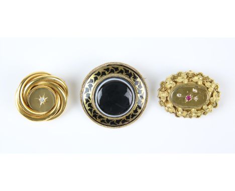 Three Victorian brooches, one circular, set with transitional cut diamond to the centre, with picture back and safety chain, 