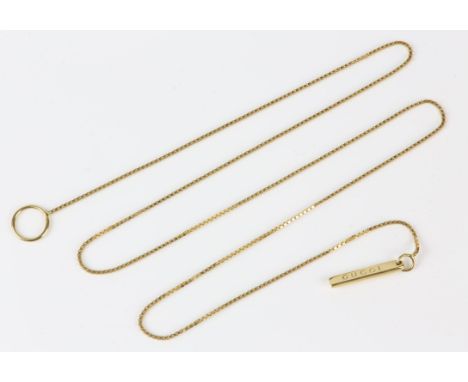A Gucci necklace and earrings set, including a box link lariat necklace, 54cm in length, in 18 ct, together with a pair of ba