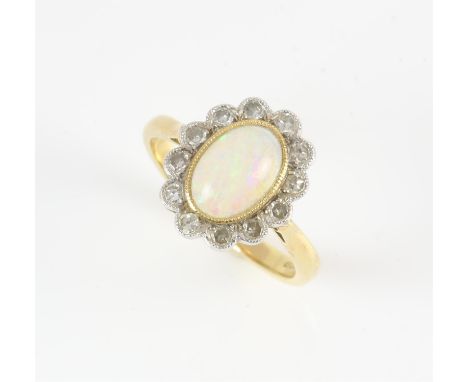 Opal and diamond ring, central oval cabochon cut opal, estimated weight 0.70 carat, surrounded by eight cut diamonds, estimat