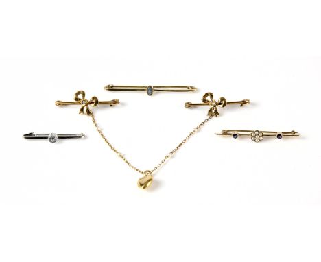 A collection of brooches, including two single stone aquamarine bar brooches together with a pearl double bar brooch, with a 