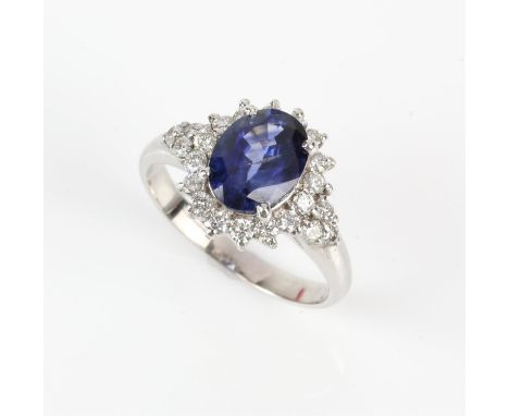 Sapphire and diamond ring, central oval cut sapphire weighing an estimated 1.50 carats, with a surround of round brilliant cu