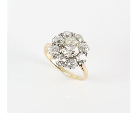 Diamond cluster ring, central old cut diamond weighing an estimated 1.49 carats, with an estimated colour of L-M and estimate