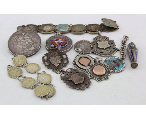 Mixed lot of silver items, which includes medals (6) coin bracelets (2) one is silver plate, enamel coins (2) brooched,   188