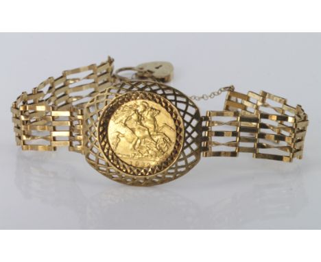 1982 half sovereign in lattice bracelet mount on gate link bracelet with heart padlock clasp and safety chain, weight 11.6g.