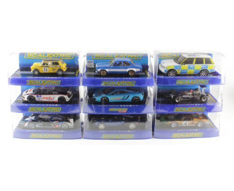 Scalextric. Nine boxed Scalextric models, comprising Range Rover Police Car (C2833); Ford Escort MK1 (C3592); Mini Cooper S (