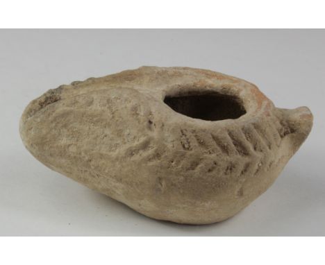 Ancient Roman decorated Oil Lamp , ca. 400 AD. Impressed Laurel Wreath decoration. Complete and in very good condition.  90 m