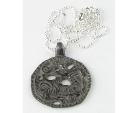 Viking Silver Dragon Fafnir Amulet , ca. 900 AD, Rare, open-work cast pendant depicting the Dragon Fafnir; mythological artif