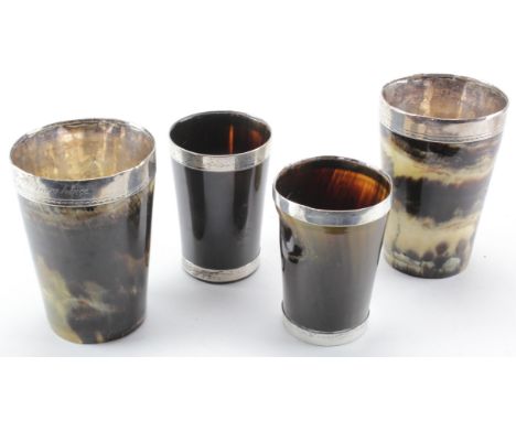 Four white metal rimmed horn hunting beakers, two larger beakers with engraved inscription to rim, height 12.5cm approx. and 