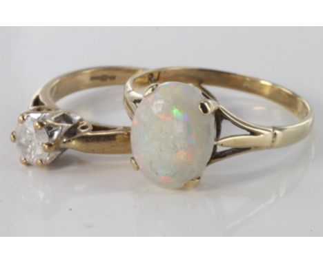 Two 9ct yellow gold rings, single oval opal ring, size M, 1.5g. 9ct diamond solitaire ring, size I, weight 2g.