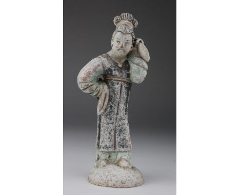 Ming Dancing Lady, C. 1368 - 1644 A.D. Ming Dancing Lady holding an item on her left shoulder. With green, red and black glaz