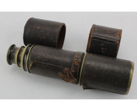 Four drawer brass and leather telescope, engraved W. Mac Donnell & Co., in need of some restoration,  with leather covers, ex