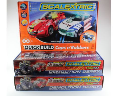 Scalextric. Three Scalextric Quick Build boxed sets, comprising Cops n Robbers; Demolition Derby Metal Alien vs White Skull x