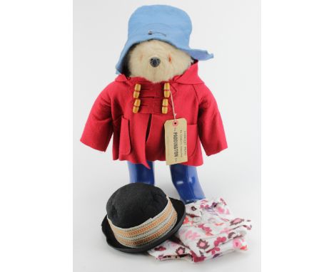 Gabrielle Paddington Bear with red coat, blue hat and blue dunlop boots, with original label, height together with a pair of 