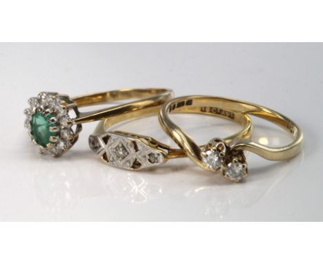 18ct and platinum diamond three stone ring, size Q, weight 1.9g. 9ct emerald and diamond cluster ring, size N, weight 1.2g. 9