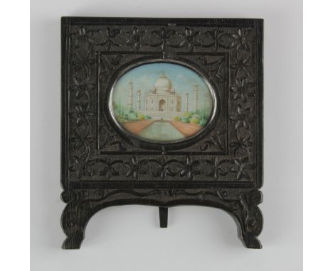 Miniature depicting the Taj Mahal, circa late 19th to early 20th century, contained in an easel backed carved wood frame, ima