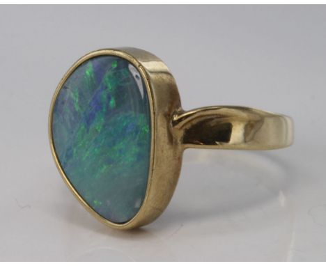 9ct yellow gold ring set with single opal matrix stone, size U, weight 4.6g.